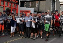 Bude Mountain Bike Riders hand over bike ride proceeds following cycle from Minehead to Plymouth