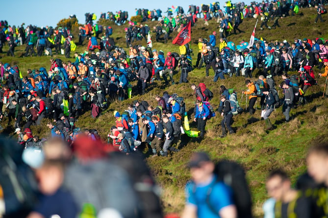 Pictured;The mass start of Ten Tors 2019 as they walk down a very steep hill.TEN TORS AND JUBILEE CHALLENGE (EXERCISE WYVERN TOR) 2019  As well as a vital high-level military resilience exercise - called Exercise WYVERN TOR - The Ten Tors Challenge is also one of the biggest outdoors adventure events for young people in Britain today. In all, 2400 youngsters aged between 14 and 19 will take part in Ten Tors, with a further 300 youngsters with physical or educational needs taking part in the Jubilee Challenge.The majority of the teams who enter Ten Tors are from schools and youth groups from across the South West. These include scout groups, sports and ramblersÕ teams and Armed Forces cadet units, all of whom have trained hard over the last few months and are ready to accept the challenge!Those teenagers taking part will trek unaided over different 35, 45 or 55 mile routes and will encounter some of the toughest terrain and highest peaks in Southern England. They will rely on their navigational skills and will carry all their food, water, bedding, tents and other essentials as they go. It is a feat they must complete as a team and without any help from adults and theyÕll remain entirely self-sufficient during their arduous expeditions, including camping out overnight on the moor.One of the most enduring legacies of Ten Tors is a lasting appreciation of the beauty of Dartmoor which is instilled in every young person taking part. For some it may be the first time they have spent any length of time walking in the countryside. For many it is sure to ignite a passion for the outdoors which stays with them forever. But for all it is something theyÕll never forget, and team managers are guided to encourage participants to develop respect and appreciation for the landscape, cultural heritage and wildlife of Dartmoor.Photographer:CPL BEN BECKETT RLC /MoD Crown Copyright