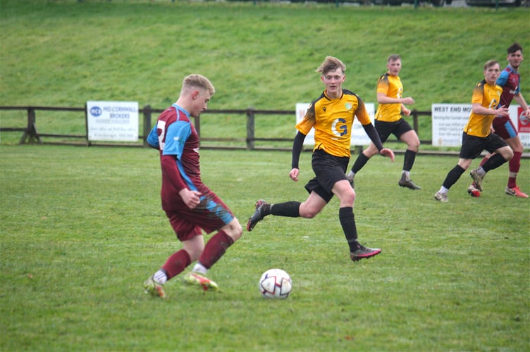 Launceston right-back Mark Wilson prepares to put a cross into the Bodmin Town box.