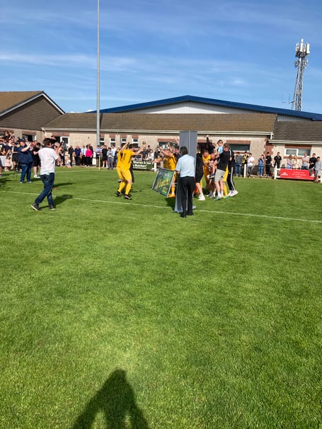 Torpoint Athletic celebrate winning the cup last season at Launceston AFC.