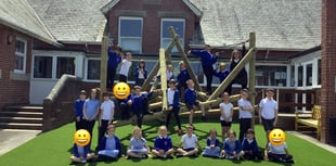 Students show off their climbing skills on new play equipment