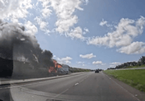 Video shows coach ablaze on the A30