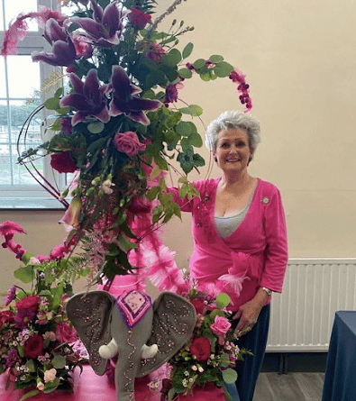 Susan Griffiths with her pink creation at Bude flower club
