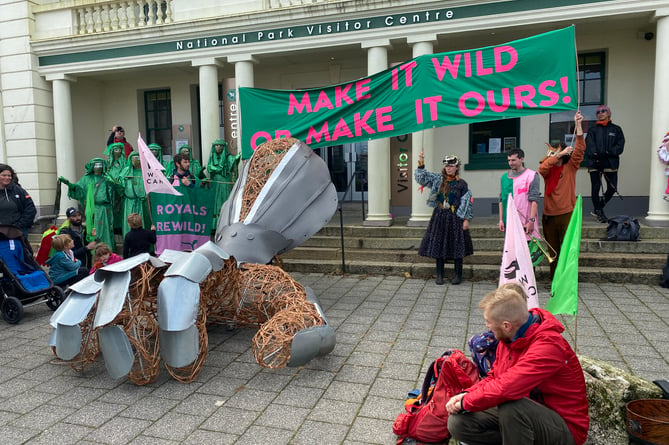 Rewilding protesters lay down a symbolic giant gauntlet to Prince William outside the Duchy estate offices in Princetown.1.