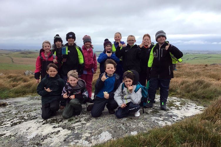 13 students took on the challenge, battling through rain, wind, and cold on their journey 