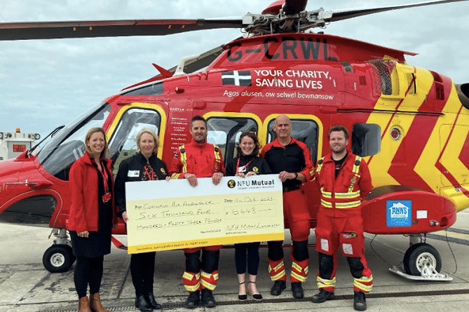 LEFT to right: Julia Jeffery, corporate fundraising officer at Cornwall Air Ambulance, Cheryl Valter agent
Launceston NFU Mutual and Rachel Sleep agent Launceston NFU Mutual with crew members from the Cornwall
Air Ambulance