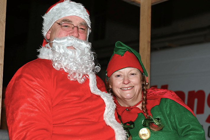 Father Christmas arrives along with his elf