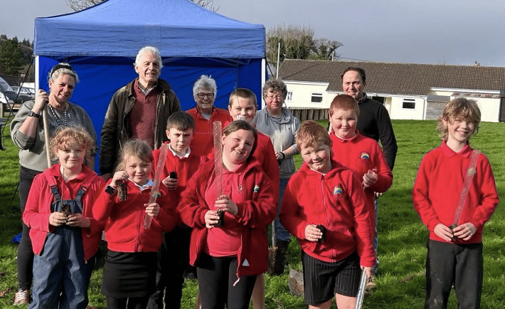Parents, children and councillors got stuck in planting more than 200 saplings