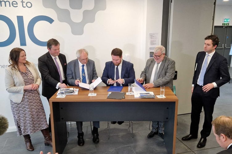 At the signing of the proposed Deal, from left: Alison Hernandez, Police and Crime Commissioner for Devon, Cornwall and the Isles of Scilly; Kevin Foster, MP for Torbay; Councillor John Hart, Leader of Devon County Council; Jacob Young, Levelling Up Minister; Councillor David Thomas, Leader of Torbay Council and Anthony Mangnall, MP for Totnes.