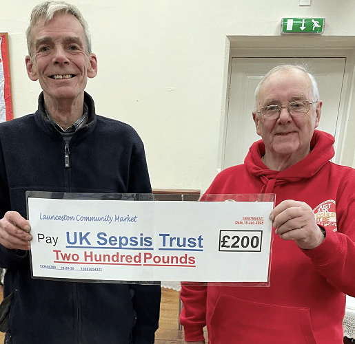 Paul Jellyman (left) presenting Victor Briggs of UK Sepsis Trust with a cheque for £200