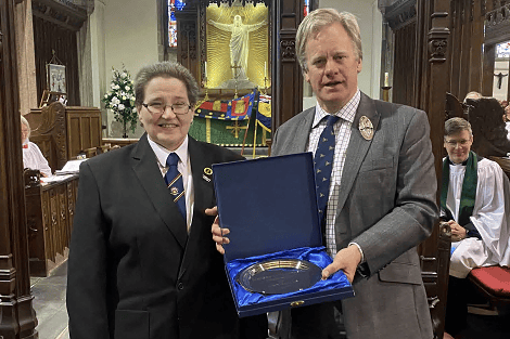 Ann Brown of Launceston Town Band receiving the Mayor’s Civic Award from the High Sheriff of Cornwall Toby Ashworth