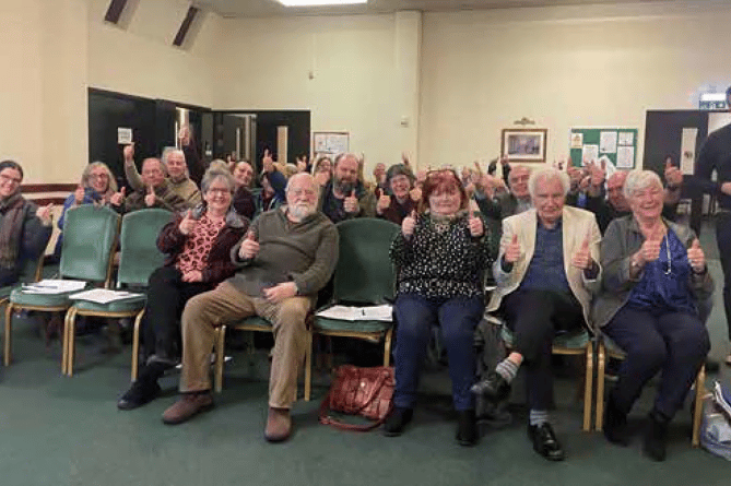 DELIGHTED residents celebrate the Bodmin Town Council decision to object with Scott Mann