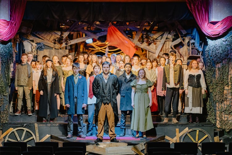 The cast singing 'One More Day'