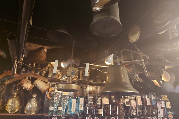 The ceiling beams of the venue feature a litany of old objects bartered for beer