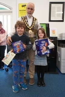Decorated egg competition winners Molly, Caiden and Hallie with Mayor Cllr Rob Rotchell