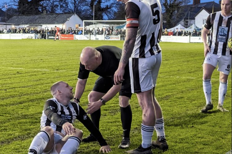 Holsworthy striker Gavin Carter speaks to referee Luke Dennis during last season's SWPL Premier West home clash with Bude Town which was held on Good Friday. Picture: Russell Cox