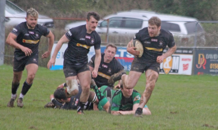 Launceston's Charlie Tummon, who scored a first half hat-trick, runs at the Ivybridge defence.