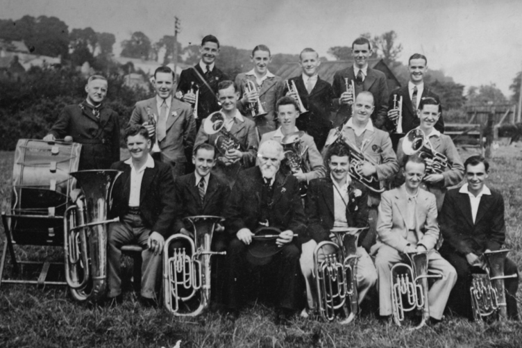 THE Post is grateful to Chris Wonnacott for supplying this photograph of Stratton Band in 1938. Pictured (back row) D Davey, S Cobbledick, C Crowell, B Jewell, S Wonnacott; (middle row) C Davey, B Ford, C Colwill, ? Joliffe, A Bissat, S Ford; (front row) F Dymond, G Colwill, ? Rattenbury, B Cann, A Parnacott, B Wonnacott. Chris said: "This 1938 photo - of Stratton Band - includes my father (Samuel Albert Wonnacott - back row - far right) who as you can see played cornet. I followed in my fathers footsteps - also playing cornet in the 1960s, for what was then known as “Stratton Town Silver Band” - when the Bandmaster was Walter Parnell.
During the summer months, we often paraded through Stratton streets playing the Floral Dance - followed by locals and visitors enjoying joining in to dance, behind the band. I would be interested to know if anyone has a photograph of the 1960s band I played in, as I do not have any, and would like to get hold of a copy, if one exists. Enjoy your trip back to 'Times Past'." Do any of our readers recognise those pictured?
