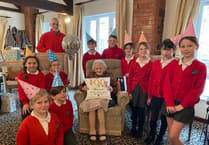 Resident celebrates 100th birthday with help from local students
