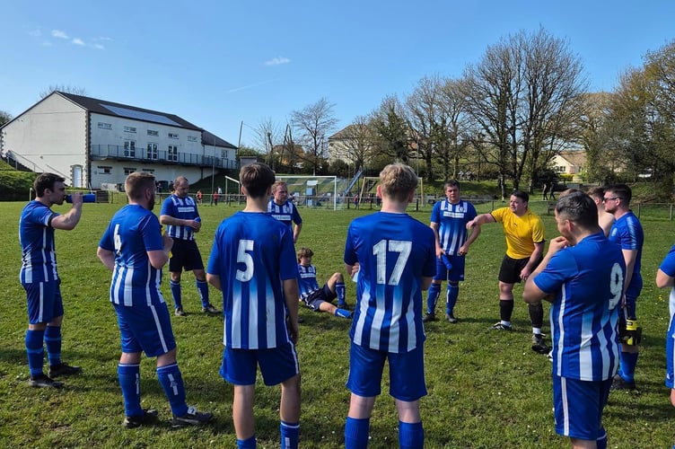Halwill player/manager Dean Rogers (yellow) chats to his players on Saturday.