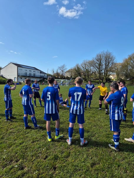 Halwill player/manager Dean Rogers (yellow) chats to his players on Saturday.