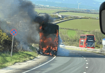 Double-decker bus fire causes A30 havoc