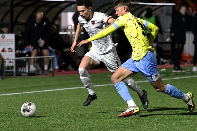 Truro City's James Melhado (left) in action against Weymouth.