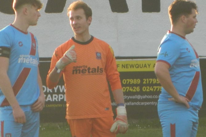 Launceston defender Jude Jago (left) was captain for the night in the absence of Mike Steele who was on the bench. He is pictured talking to Clarets goalkeeper Lewis Slade.
