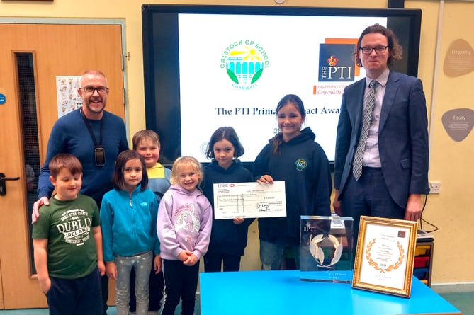 Ben Towe, executive headteacher at Calstock Community Primary School and students are pictured receiving their Prince’s Teaching Institute (PTI) Primary Impact Award from Patrick Wigg, chief operating officer