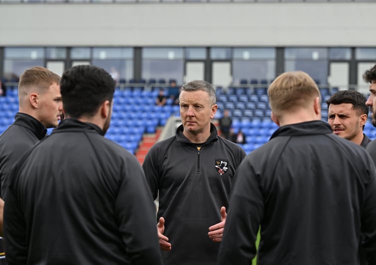 Mike Abbott (centre) will hope for a home victory on Sunday.