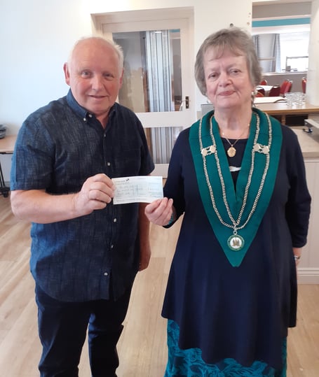 Jenny Furzeland, Devon and Cornwall area’s chief ranger, presents David Kempe, a co-ordinator for the Multiple Sclerosis (MS) Society, with a cheque