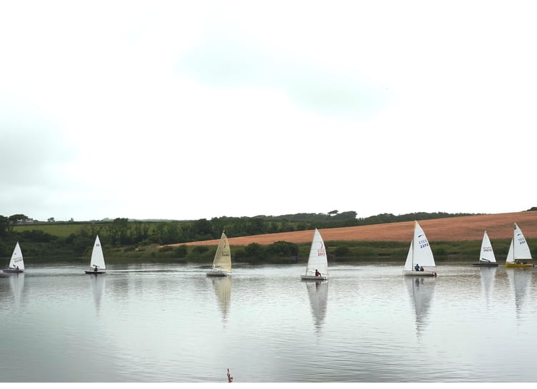 Jane Anderson leads the fleet spread out across a glassy Tamar Lake on Sunday, June 23.