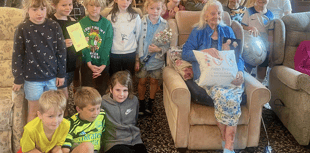 School children help resident celebrate 100th birthday