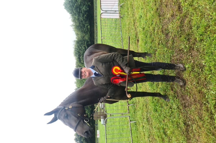 Sarah Ford of Liskeard with her two year old Irish Draft x Thoroughbred 'Cool Time Joker'. Sarah described him as a "full time joker" but his lively spirit had paid off in the ring when he was awarded champion sports horse. (Picture: Elias O'Neill)