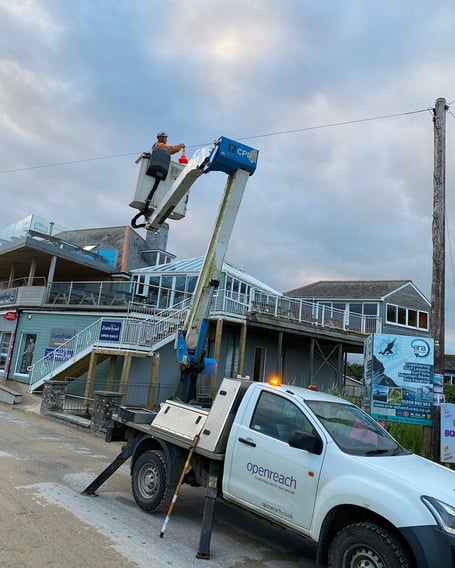 BT Openreach worker removing cone attached to phone line