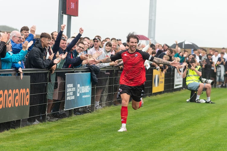 New Truro skipper Tyler Harvey celebrates his leveller against Dorking Wanderers on Saturday, the first goal in the new Truro City Stadium. Picture: Colin Bradbury