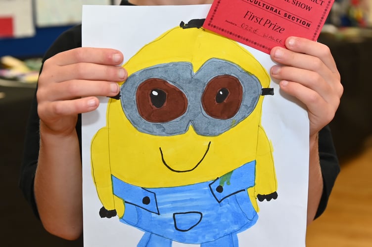 Big smiles from Ozzie Walkey of Camelford as he takes first prize with a picture of his favourite cartoon character (Picture: Adrian Jasper)