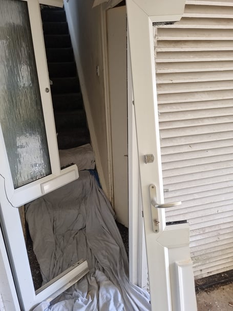 The wreckage of the door at the property raided in Bodmin