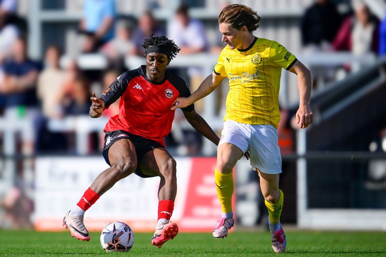Tavonga Kuleya of Truro City battles for the ball with Alfie Bates of Brackley Town during the Emirates FA Cup 2nd round qualifying tie match between Truro City and Brackley Town at Truro Sports Hub on 14 September 2024 Photo: Phil Mingo/PPAUK