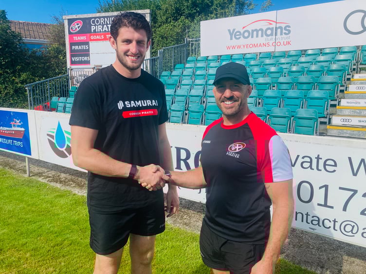 Eoin O'Connor (left) is welcomed to the Mennaye Field by Cornish Pirates' joint head coach, Alan Paver. Picture: Phil Westren