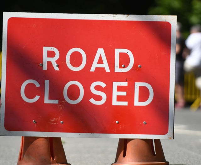 A38 closed after car overturns