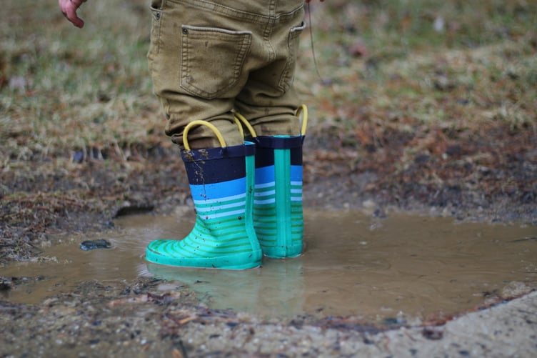 Child playing in a muddy puddle (Picture: June Admiraal/Unsplash)