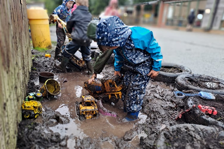 The muddy play zone has proved a hit with children, with parents saying the extra laundry bills are worth it for the joy it brings. (Picture: Holsworthy Primary School)