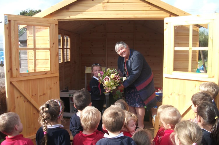 President of Launceston Rotary Club Margaret Young officially opening the new play cabin at St Giles on the Heath