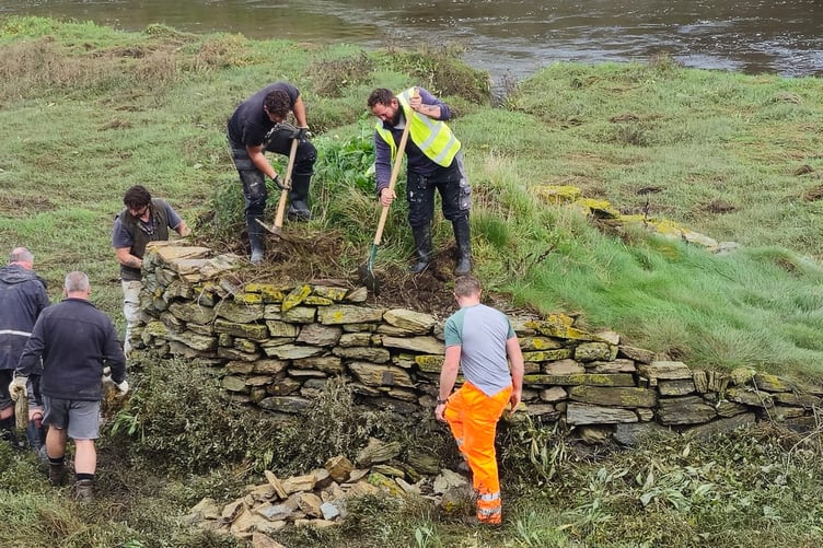 Volunteers helping to rebuild the 'swan island' in Wadebridge