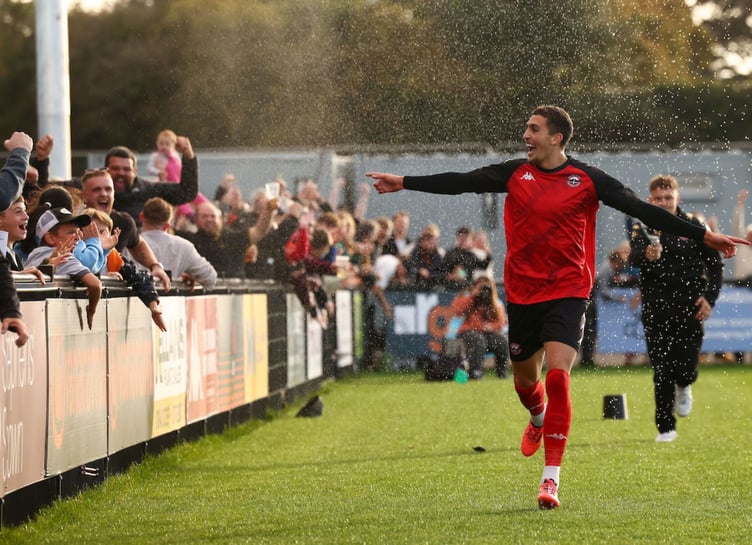 Jaze Kabia's all smiles as he celebrates his injury-time winner at the Truro City Stadium. Picture: Luke Williams/PPAUK