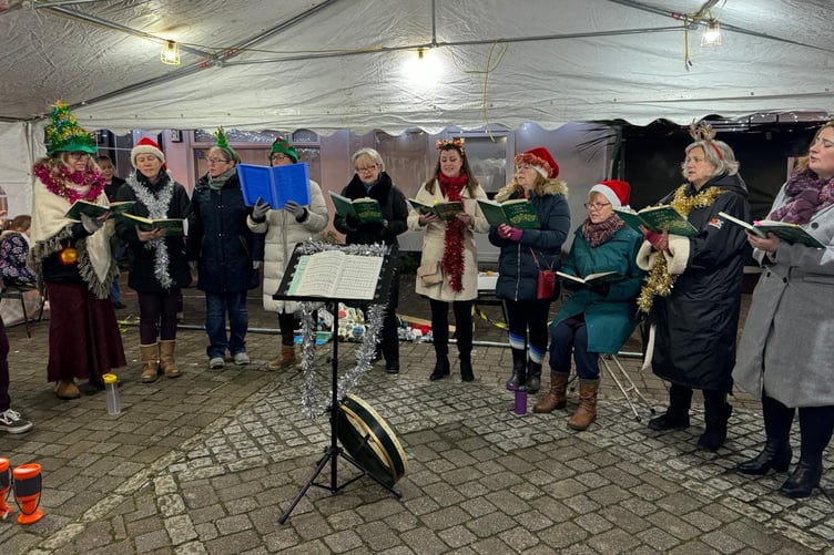 SINGERS perform at Callington's Christmas Market