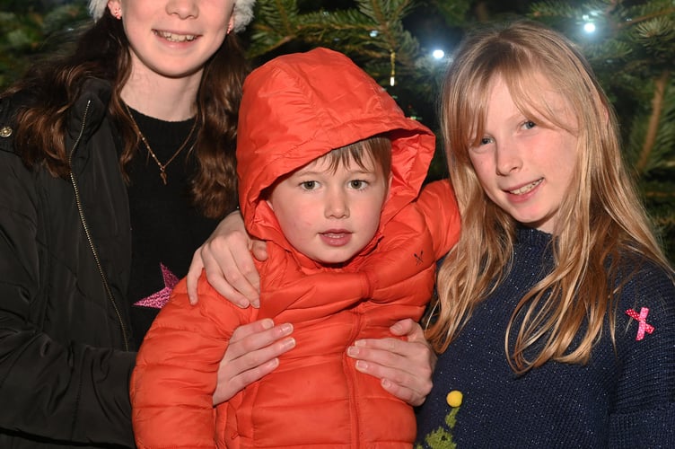 Happy to see lights in St Teath are Eleanor, Beth and Leo. (Picture: Adrian Jasper)