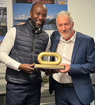 David List is presented with a link from the Torpoint ferry by ferry engineering manager Ahshawn Williams, on his last day with the Tamar Crossings. (Picture: Tamar Crossings)