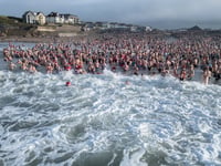 Thousands raised as hundreds brave the beach in iconic Bude tradition